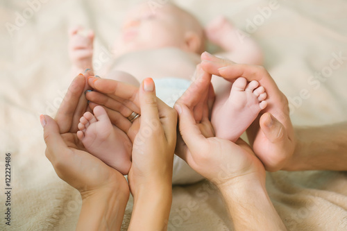 Newborn feet in parents hands
