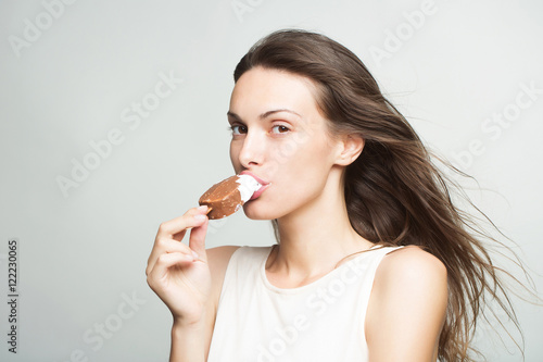 pretty girl eating ice lolly