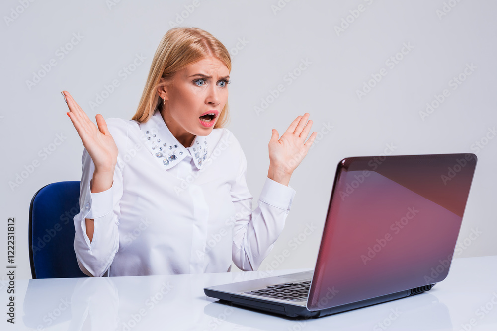 Young businesswoman working at laptop computer.