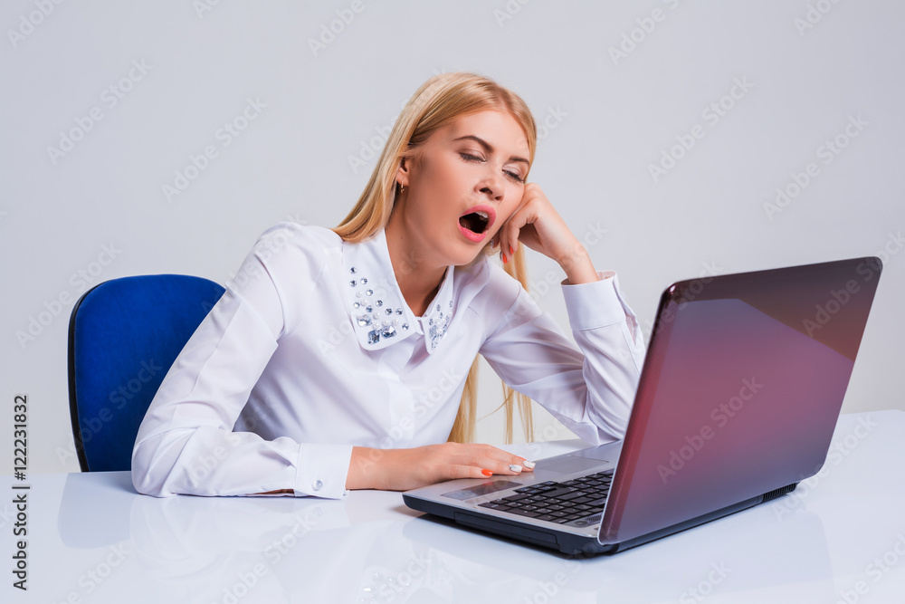 Young businesswoman working at laptop computer. Young businesswoman working at laptop computer.