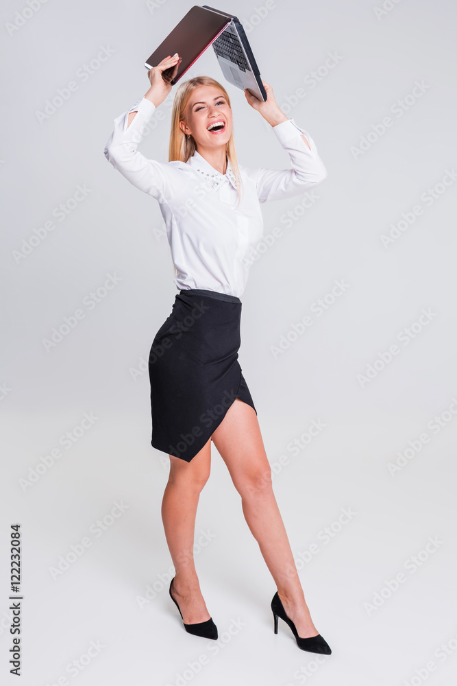Young businesswoman working at laptop computer. Young businesswoman working at laptop computer.