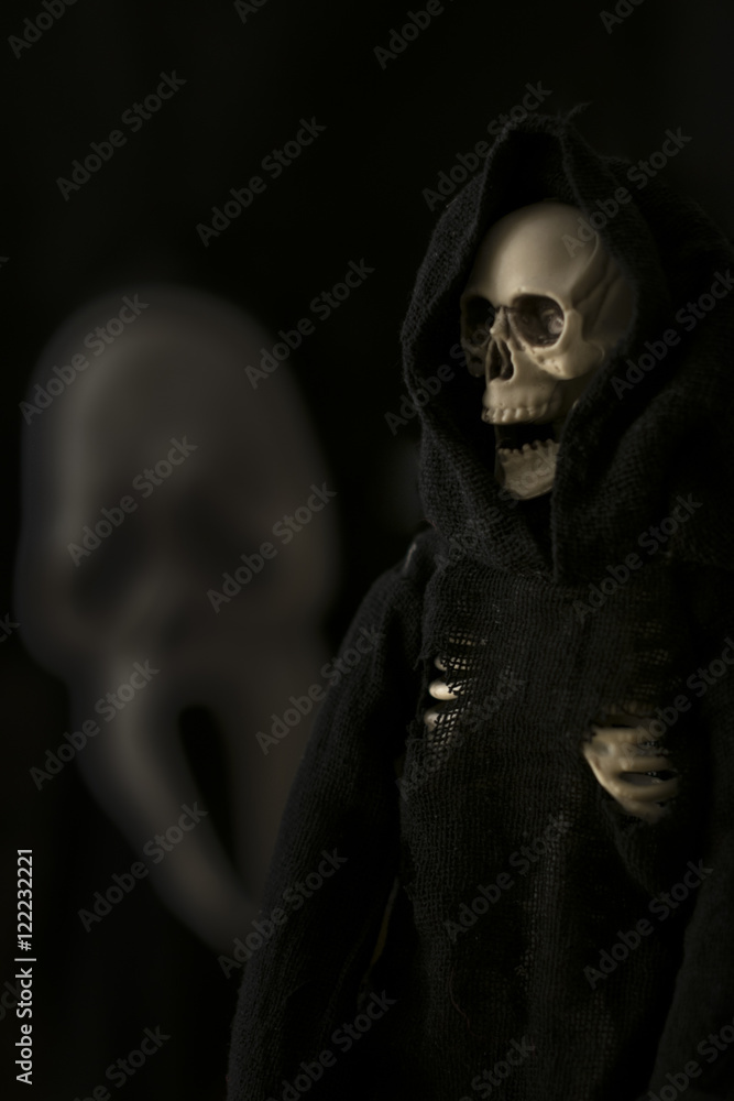 grim reaper, Halloween death character against black background with scream face grim reaper, Halloween death character against black background with scream face