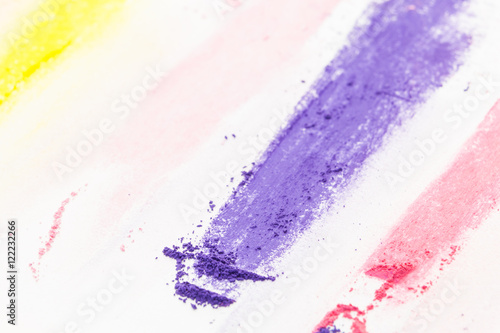 Purple pastel chalk powdered pigment closeup, on white background