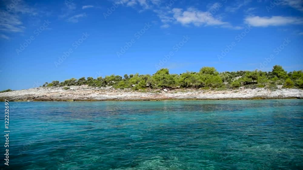 Amazing scenery with clear water and beautiful beach on Thassos island, Greece - wide shot of a beautiful coast line with no people Amazing scenery with clear water and beautiful beach on Thassos island, Greece - wide shot of a beautiful coast line with no people