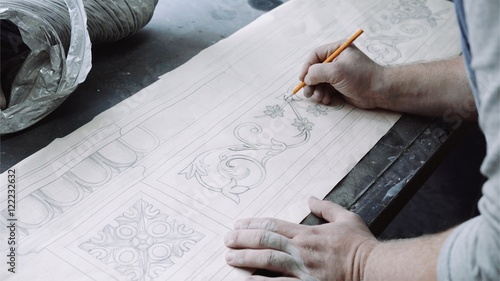 Engineer designer drawing blueprint