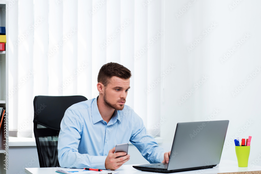 man in the office workplace laptop sitting on the table. man in the office workplace laptop sitting on the table.