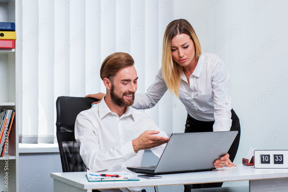 man and woman discussing a working project man and woman discussing a working project