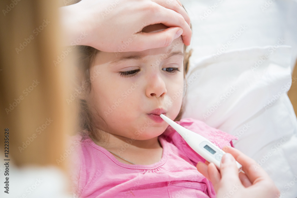 mother-measuring-temperature-of-her-ill-kid-sick-child-with-high-fever