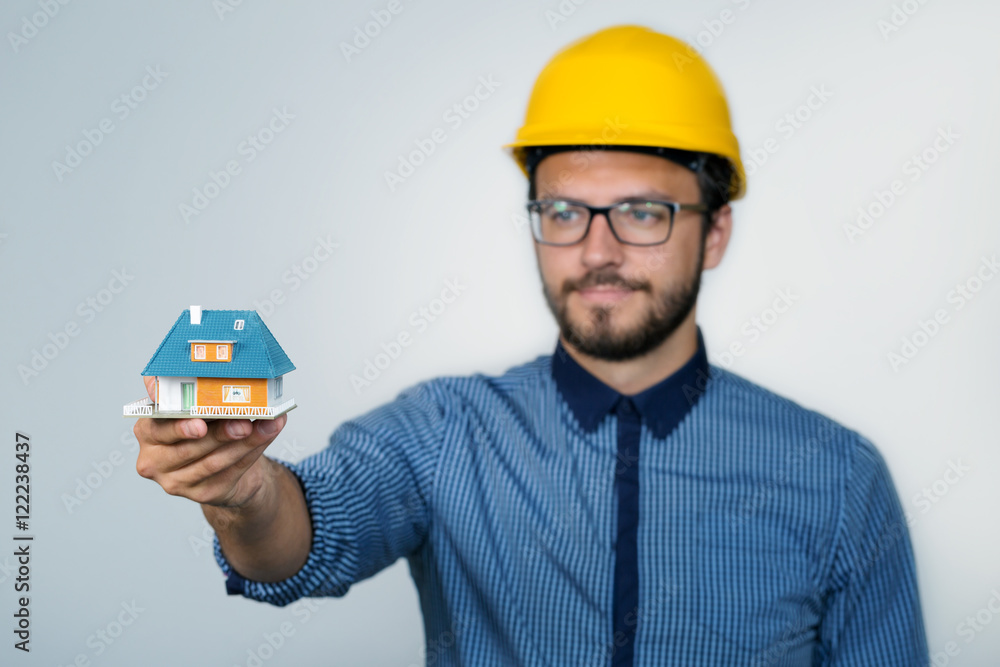construction engineer showing small house model construction engineer showing small house model