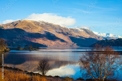 Winter landscape with mountains and lake in Scotland, UK