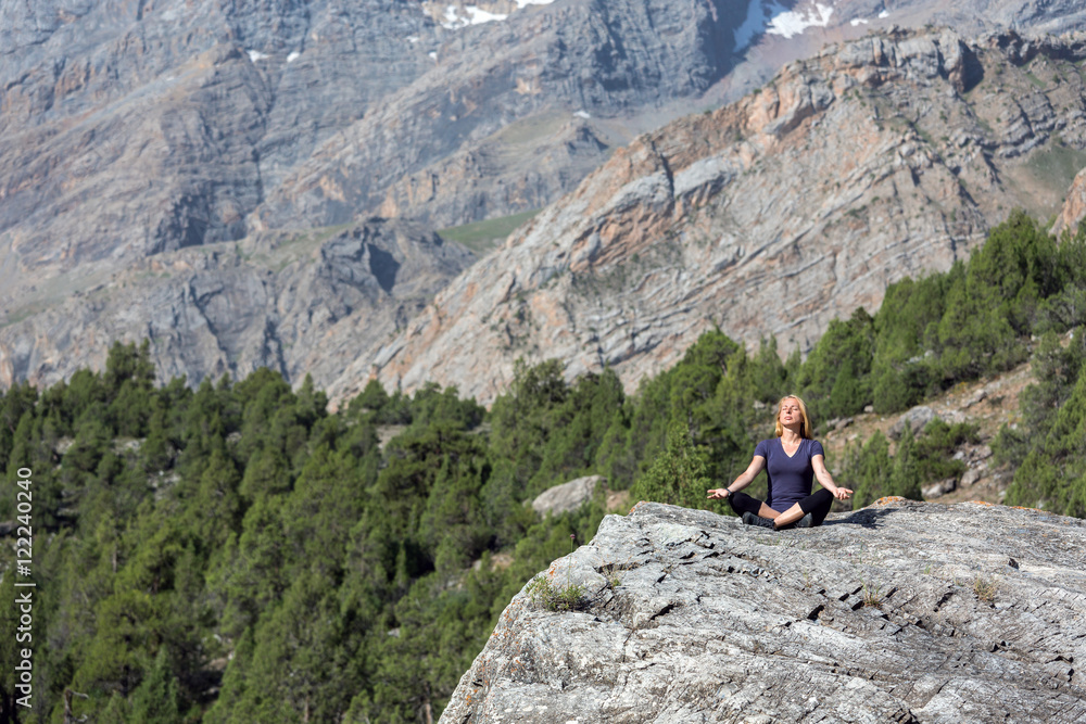 Mountain and Forest View and Woman doing Yoga