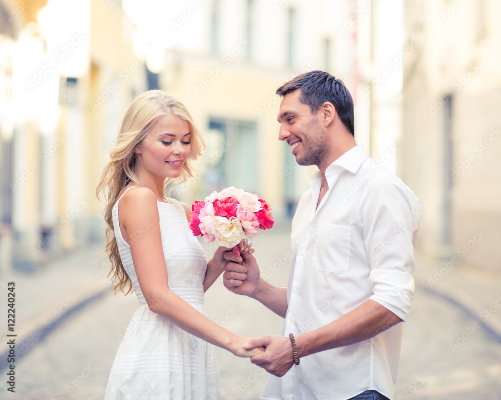 couple with flowers in the city couple with flowers in the city
