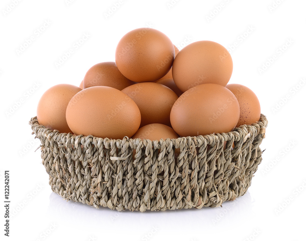 Chicken eggs in basket on white background Chicken eggs in basket on white background