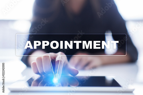 Woman is using tablet pc, pressing on virtual screen and selecting "Appointment".