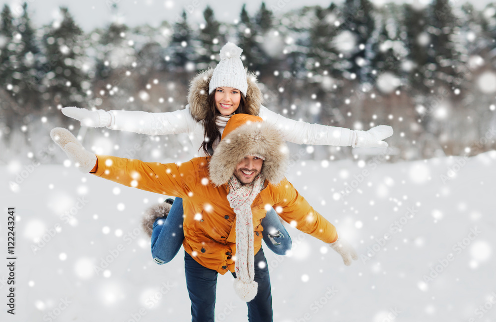 happy couple having fun over winter background happy couple having fun over winter background