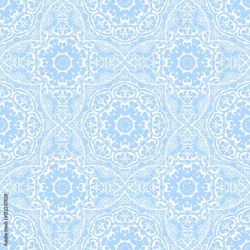 seamless pattern from white abstract elements on blue background