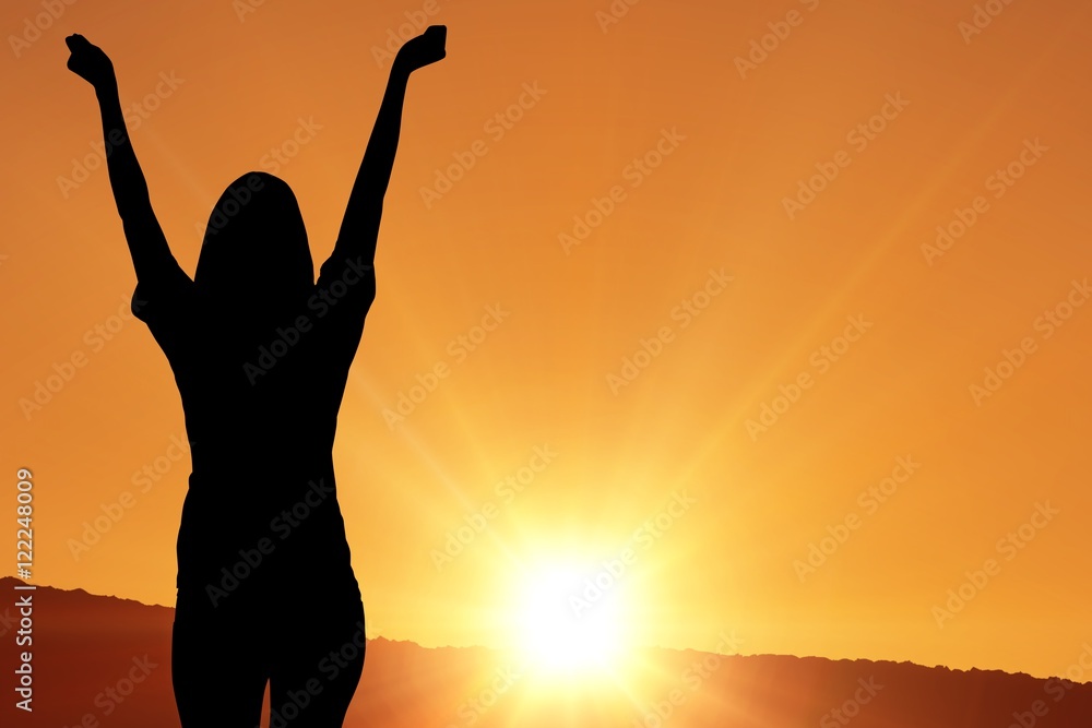 cheering silhouette on sunset background