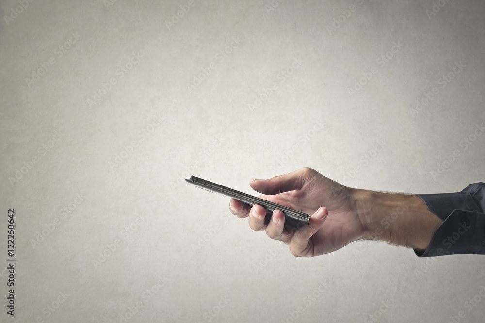 Naklejka premium Holding a smartphone