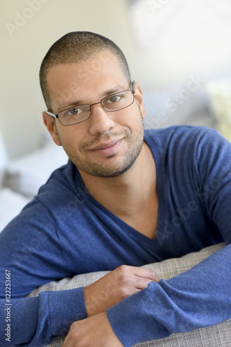 Man with eyeglasses at home relaxing in sofa