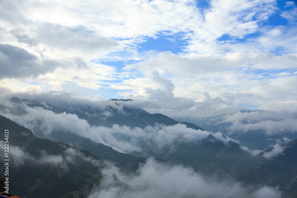 landscape with peaks covered by clouds