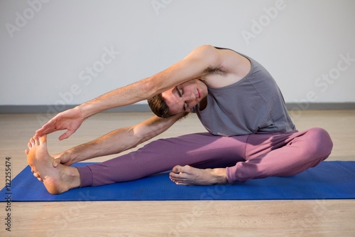 Fototapeta Naklejka Na Ścianę i Meble -  Man performing yoga
