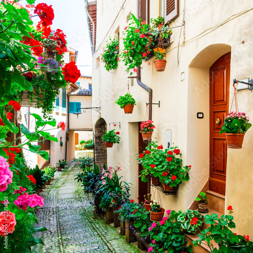 Charming floral streets of medieval Spello village in Umbria, Italy