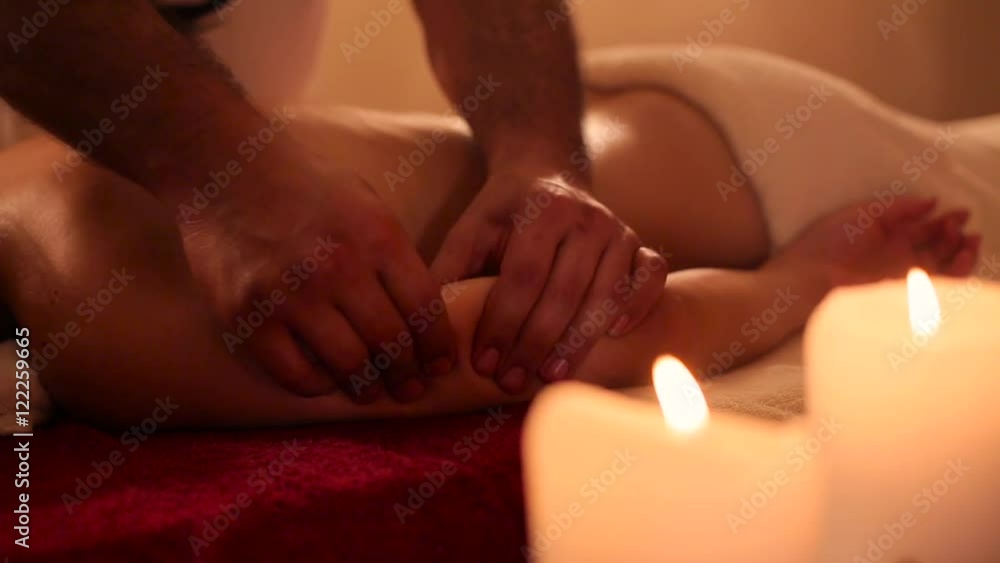 hand massage for girl with candles. hand massage for girl with candles.