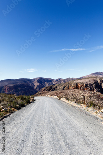 Gravel road leading to the mountains