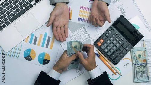 Businessmen try to split money. Greedy, intractable, uncooperative men with US dollars. 4K.