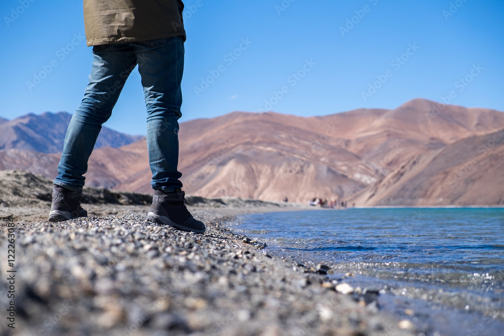 Traveler standing at lake. Travel concept. Traveler standing at lake. Travel concept.