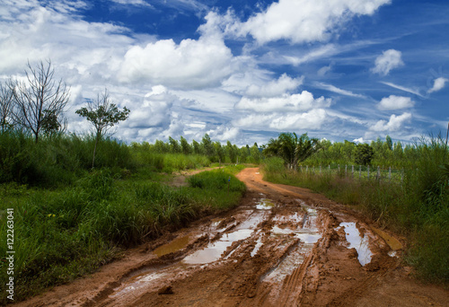 Rain makes the road muddy countryside of Thailand.