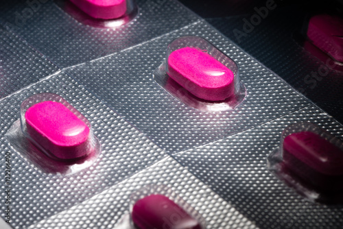 Pink antihistamine allergy benadryl tablets in foil backed blister pack