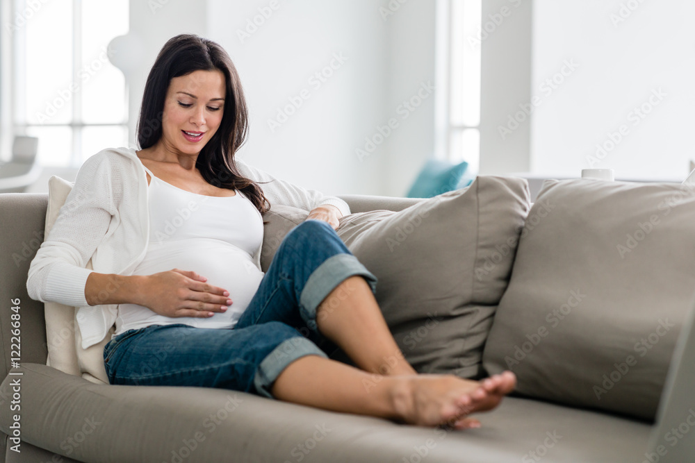 Pregnant woman lounging at home