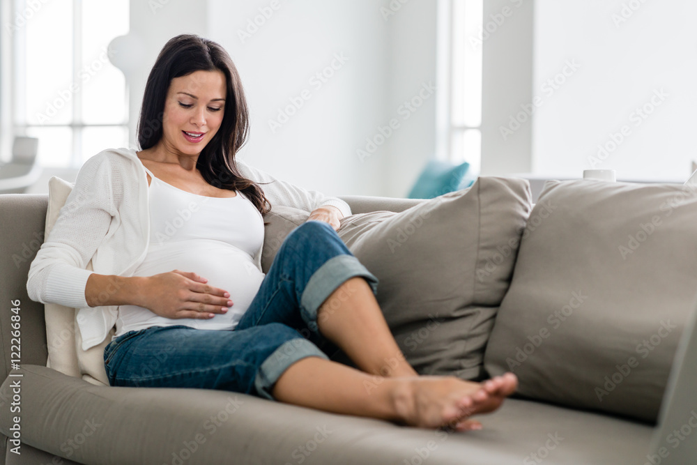 Pregnant woman lounging at home Pregnant woman lounging at home
