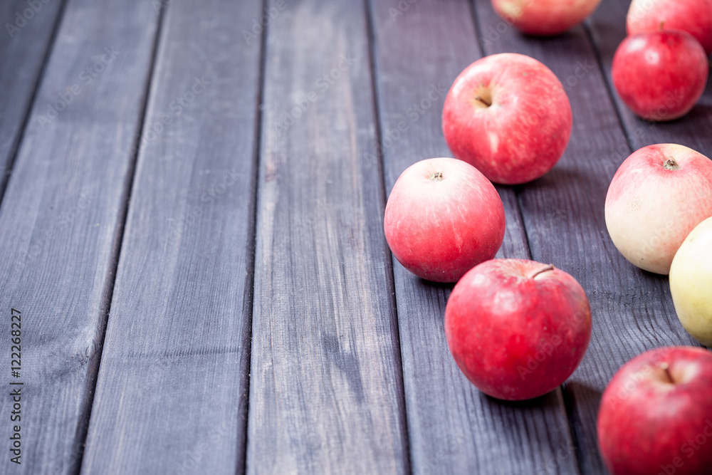 red ripe apples on wooden table background copy space photo red ripe apples on wooden table background copy space photo