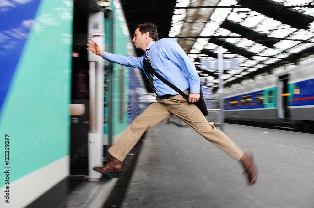 Businessman running to catch train