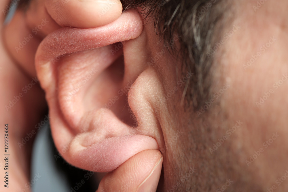 Close up of man cupping ear Close up of man cupping ear
