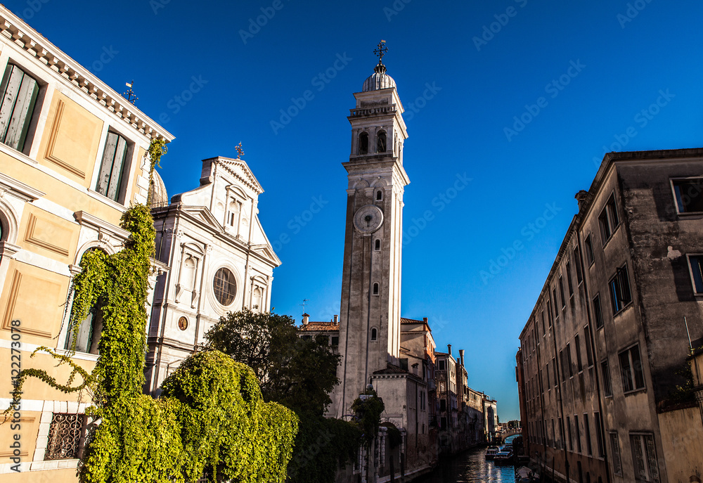 VENICE, ITALY - AUGUST 19, 2016: Famous architectural monuments and colorful facades of old medieval buildings close-up on August 19, 2016 in Venice, Italy.