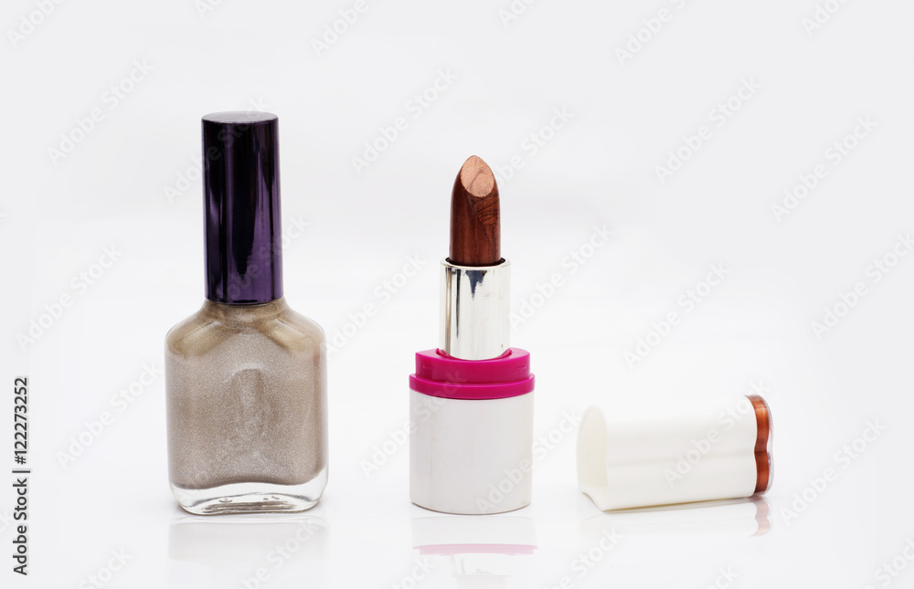 Lipstick with Nail Polish - makeup kit on white background Lipstick with Nail Polish - makeup kit on white background