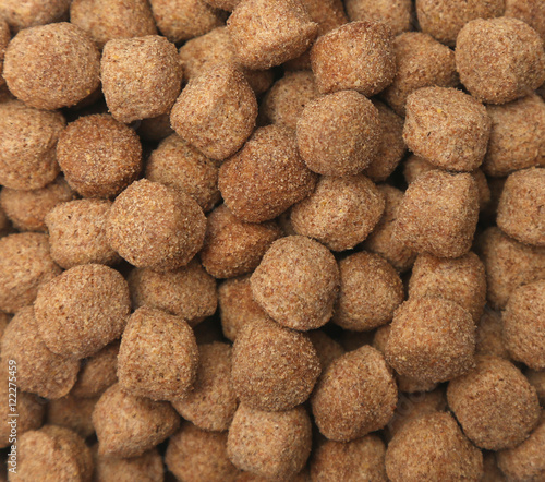 A background of brown dry dog food