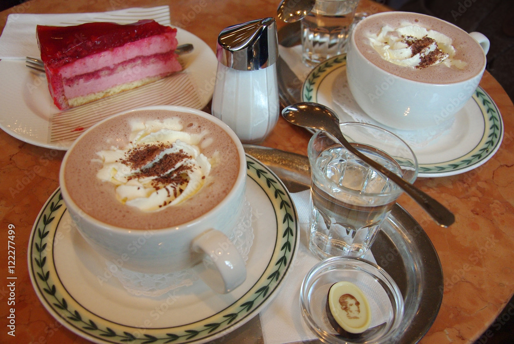 Fototapeta premium Hot chocolate and pastry at a cafe in Salzburg