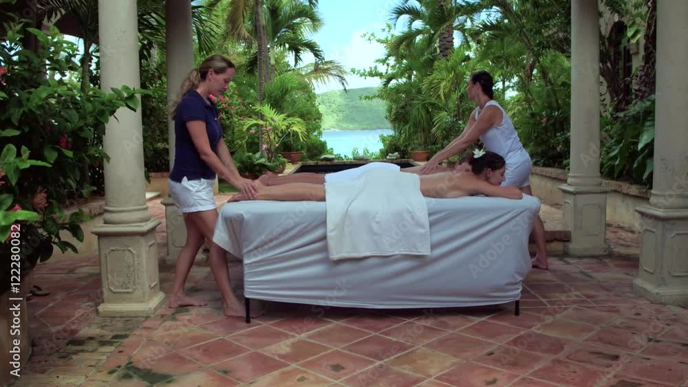 Women receiving a massage at a beautiful villa on the beach in St John, United States Virgin Islands Women receiving a massage at a beautiful villa on the beach in St John, United States Virgin Islands