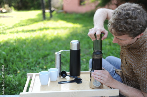 Man making coffee in nature