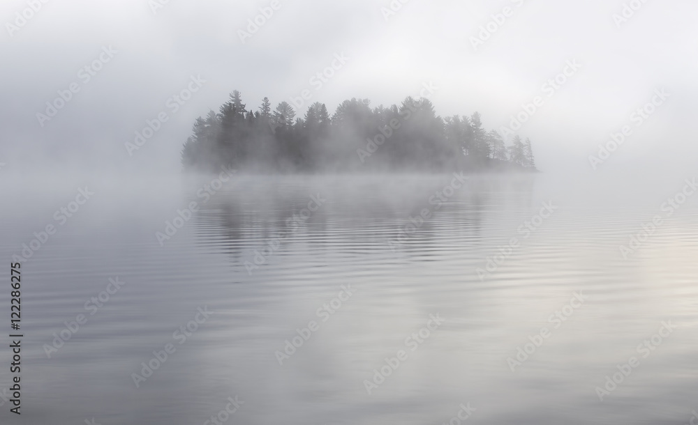 Island in the fog on Lake of Two Rivers in Algonquin Park, Canada - obrazy, fototapety, plakaty 