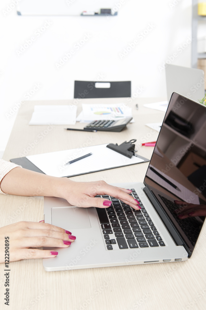 Woman hand typing on laptop keyboard Woman hand typing on laptop keyboard
