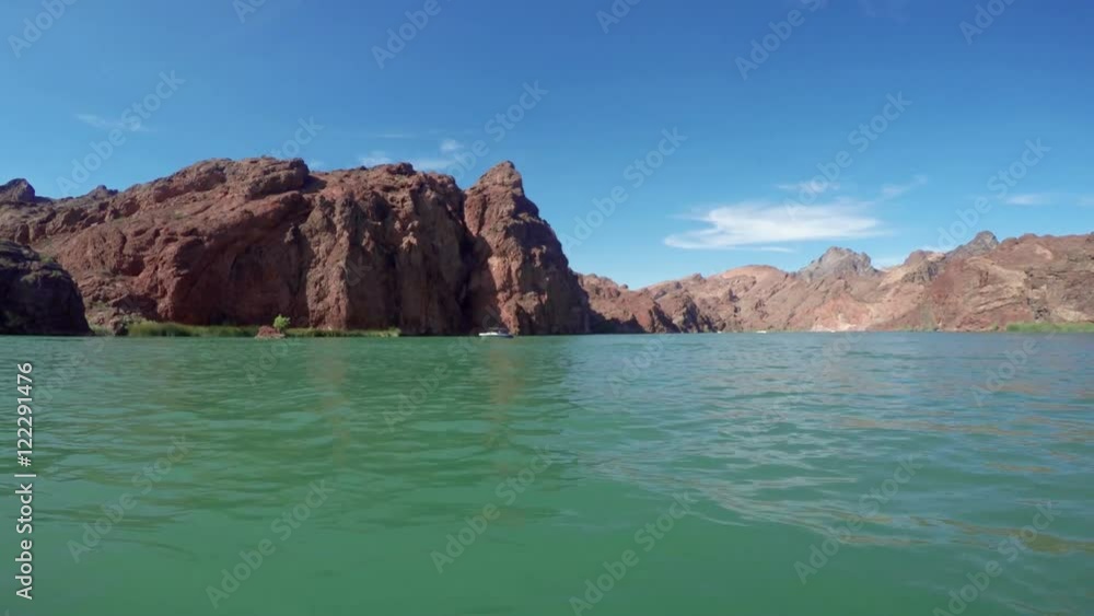 Wide angle POV from a boat cruising through a rocky channel on the Colorado river. Wide angle POV from a boat cruising through a rocky channel on the Colorado river.