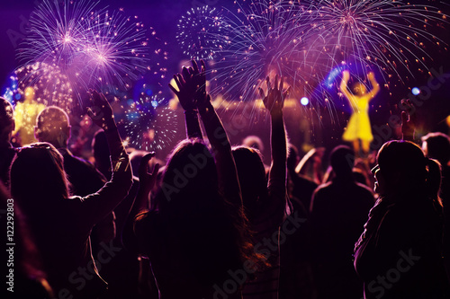 New Year concept - cheering crowd and fireworks © Melinda Nagy