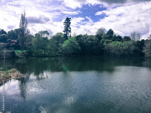 cloudy sky at large lake in midday