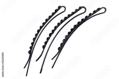 Three various black metal hairpins isolated on white background photo