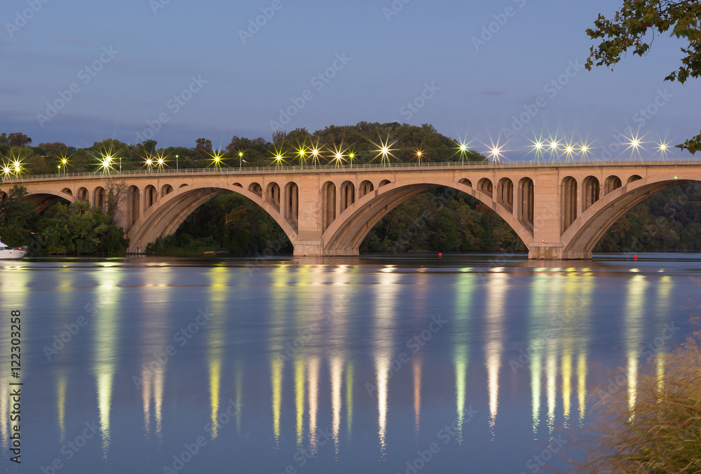 Key Bridge at sunrise in Washington Dc, USA. Bridge over Potomac River with reflections at dusk.